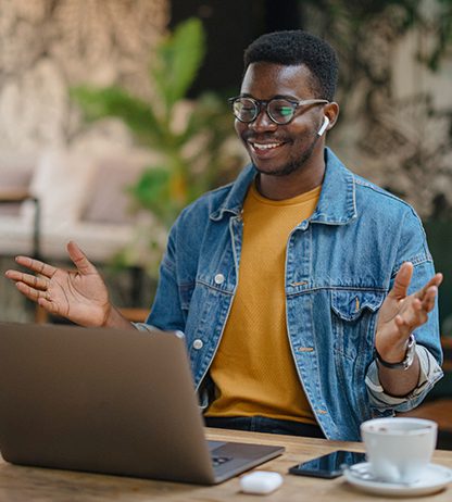 Young man studying at a coffee shop